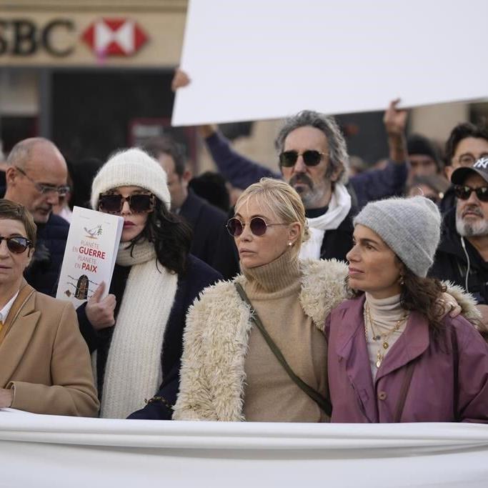 French performers lead a silent Paris march for peace between Israelis and Palestinians